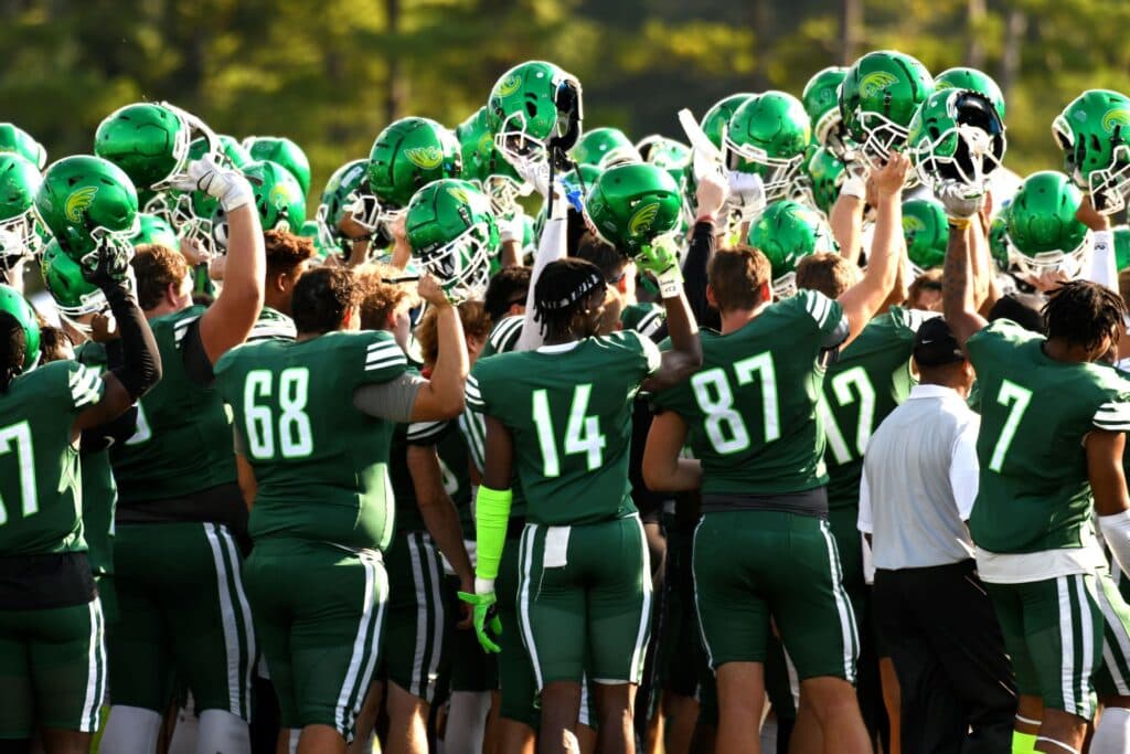 Football players in a huddle